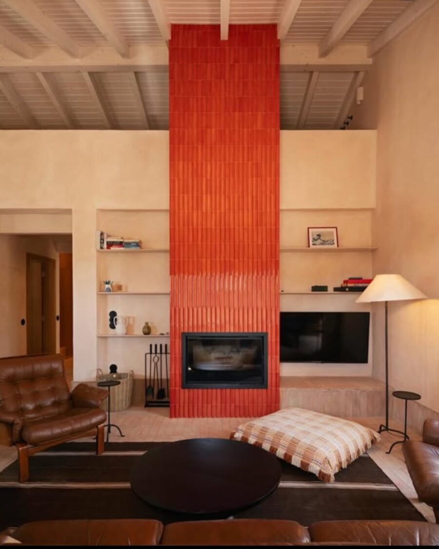 Stylish Red-Tiled Fireplace with Cozy Accents