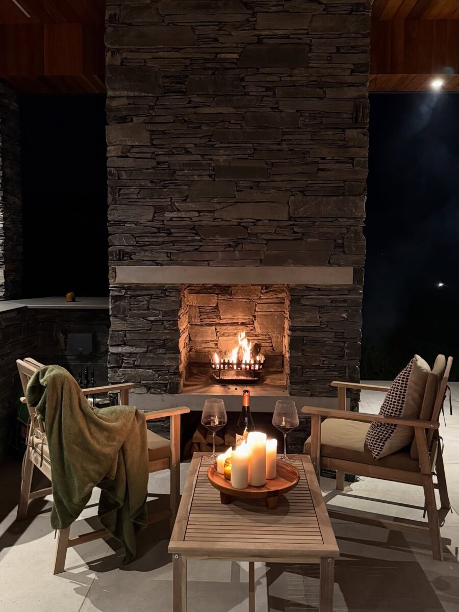 Cozy stone fireplace with serene seating arrangement