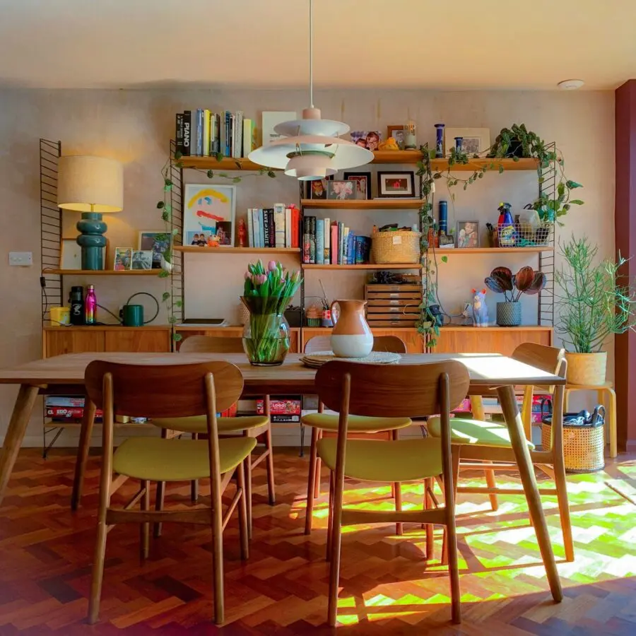 Chic and cozy dining room with greenery