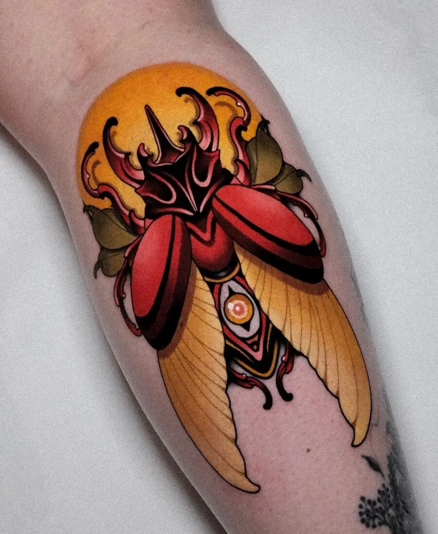 Vibrant neo-traditional beetle tattoo design