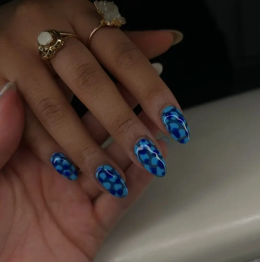 Stunning blue patterned oval nails for celebration