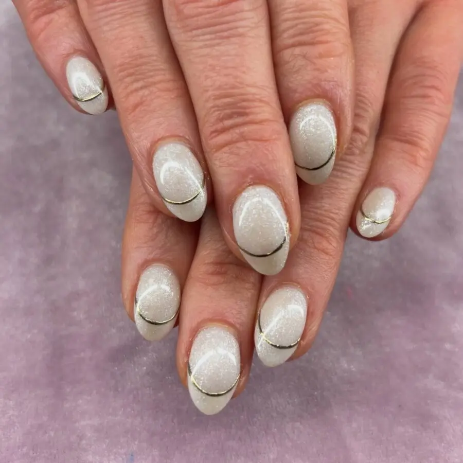 Elegant gold-stripe glitter New Year's nails