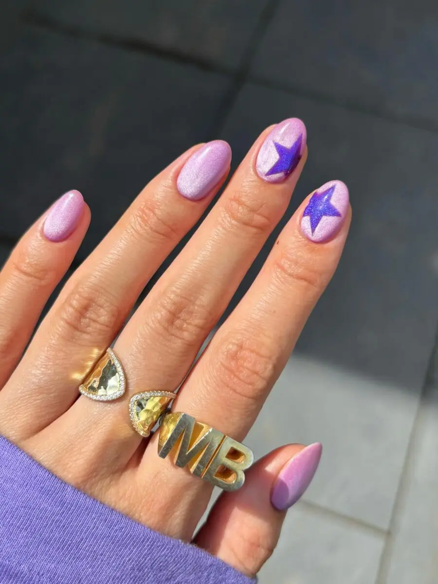 Playful Purple Nails with Starry Accents