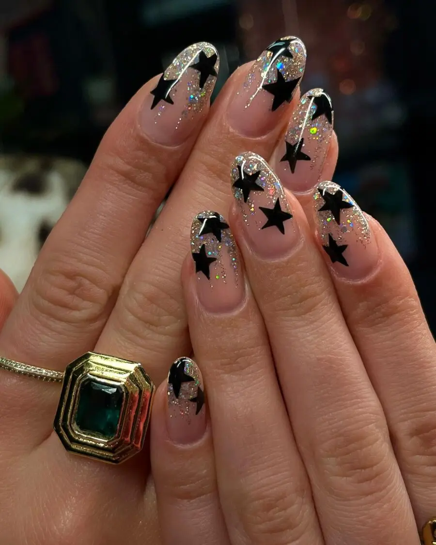 Sparkly star-accented New Year’s nails
