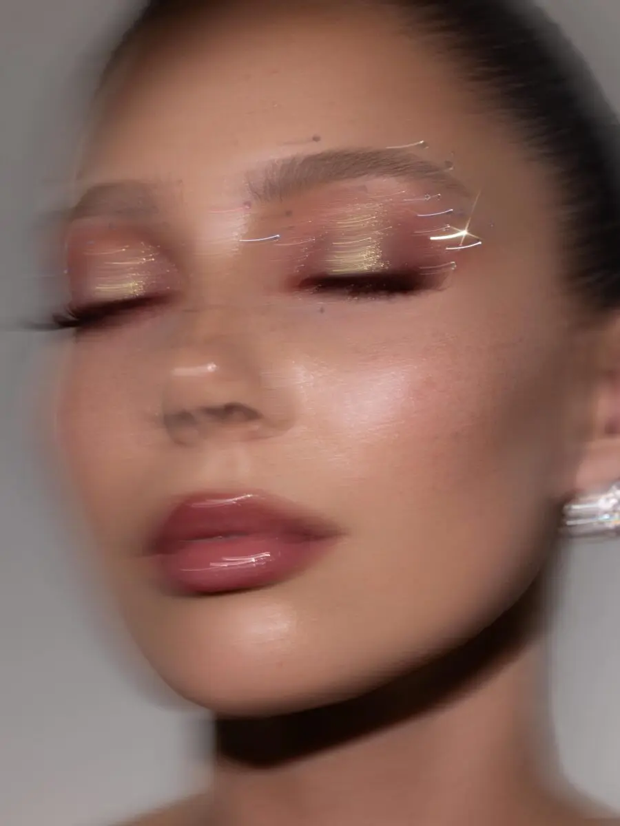 Glamorous blurred prom makeup look with shine