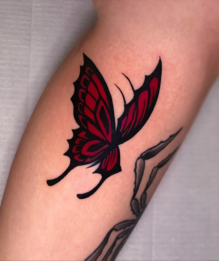 Striking red ink butterfly tattoo design