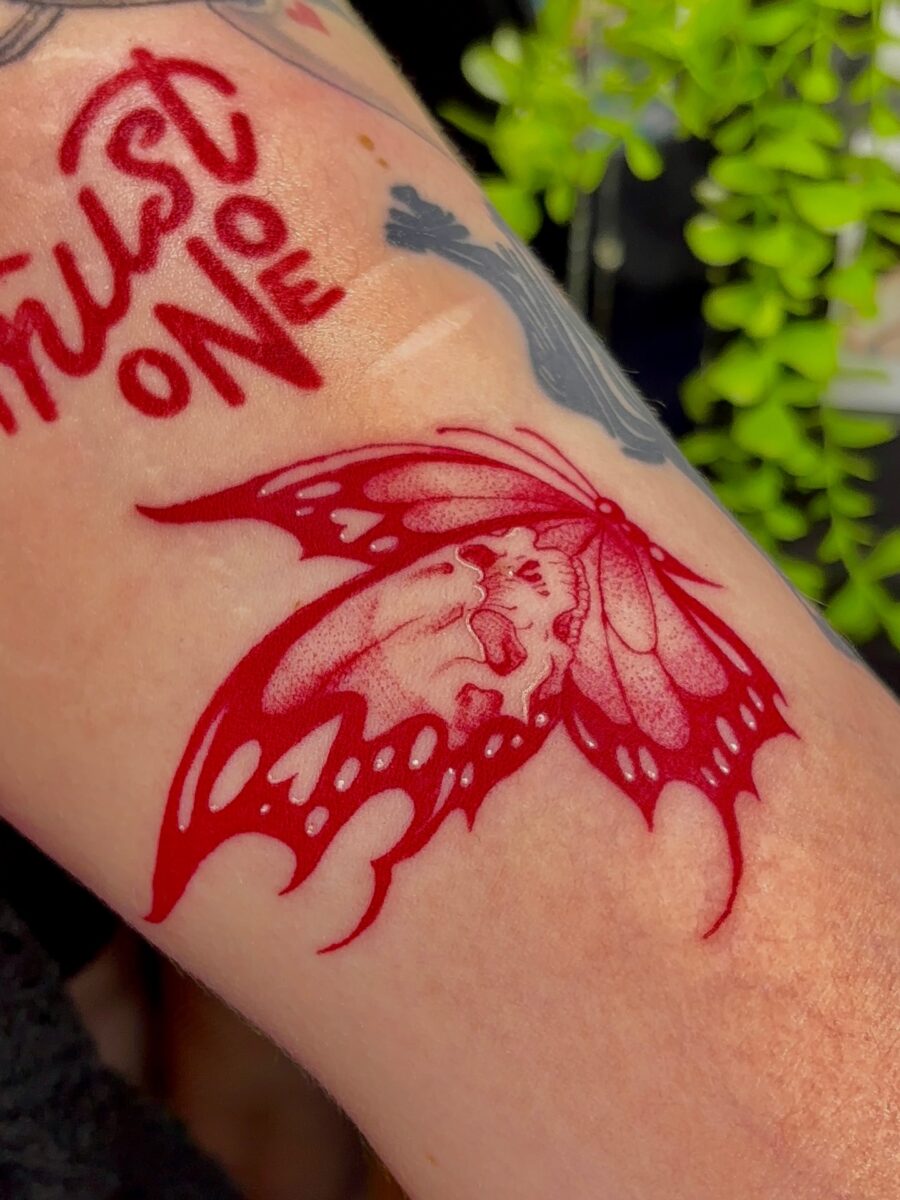 Elegant red ink butterfly tattoo design