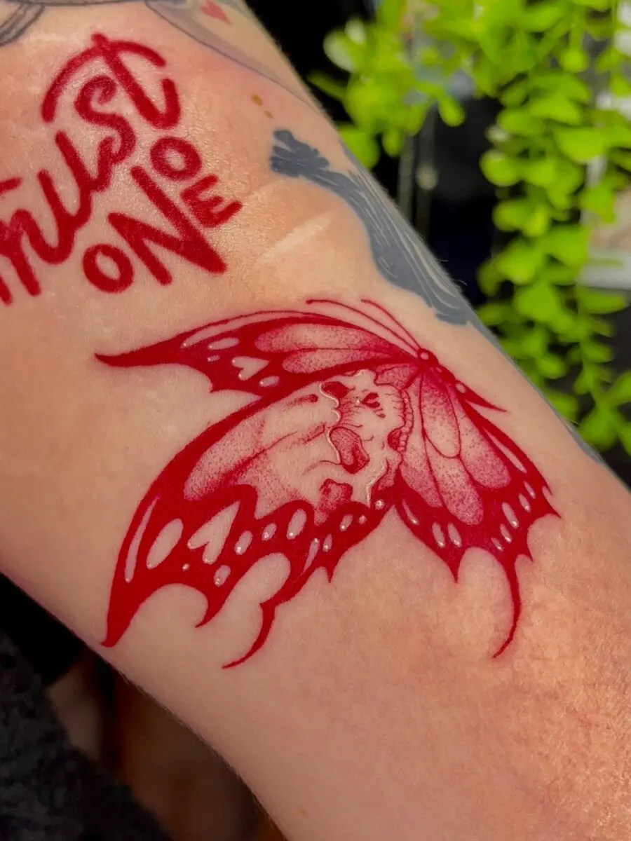 Elegant red ink butterfly tattoo design