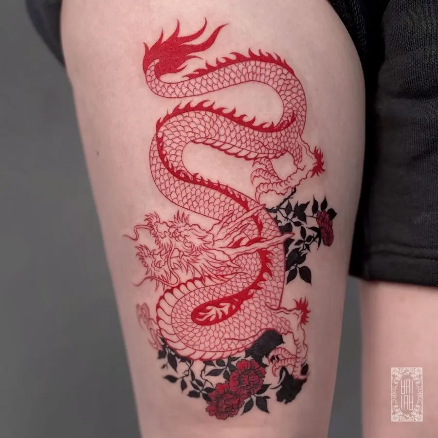 Stunning red ink dragon thigh tattoo design
