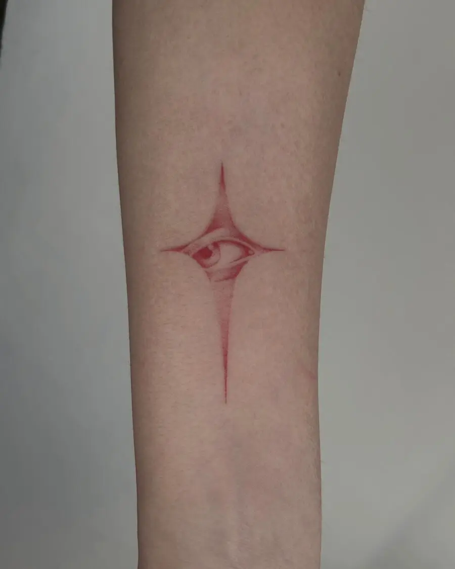 Intricate red ink eye tattoo design