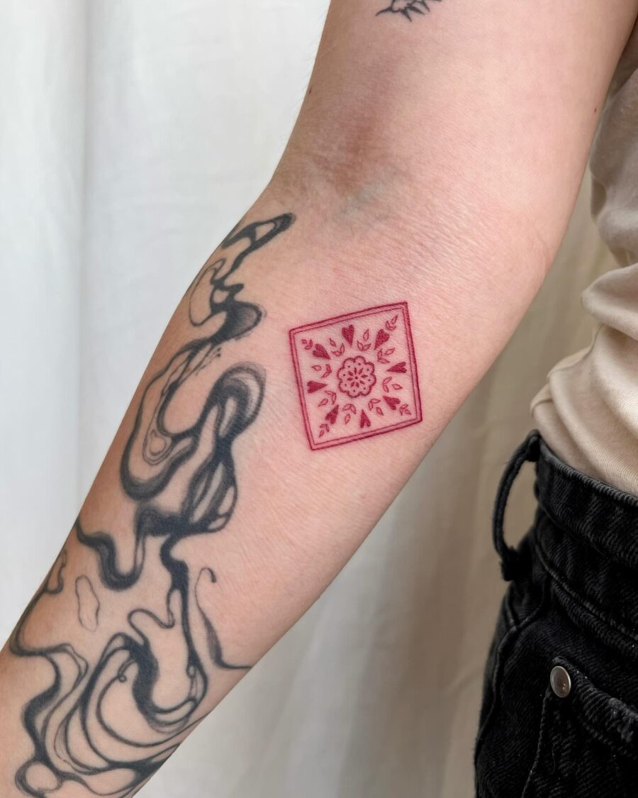 Elegant red ink floral square tattoo design