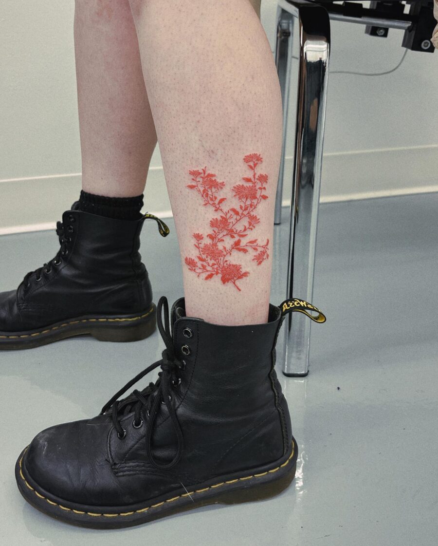 Bold Red Floral Tattoo on Leg