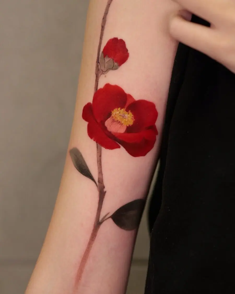 Vivid Red Floral Tattoo on Forearm