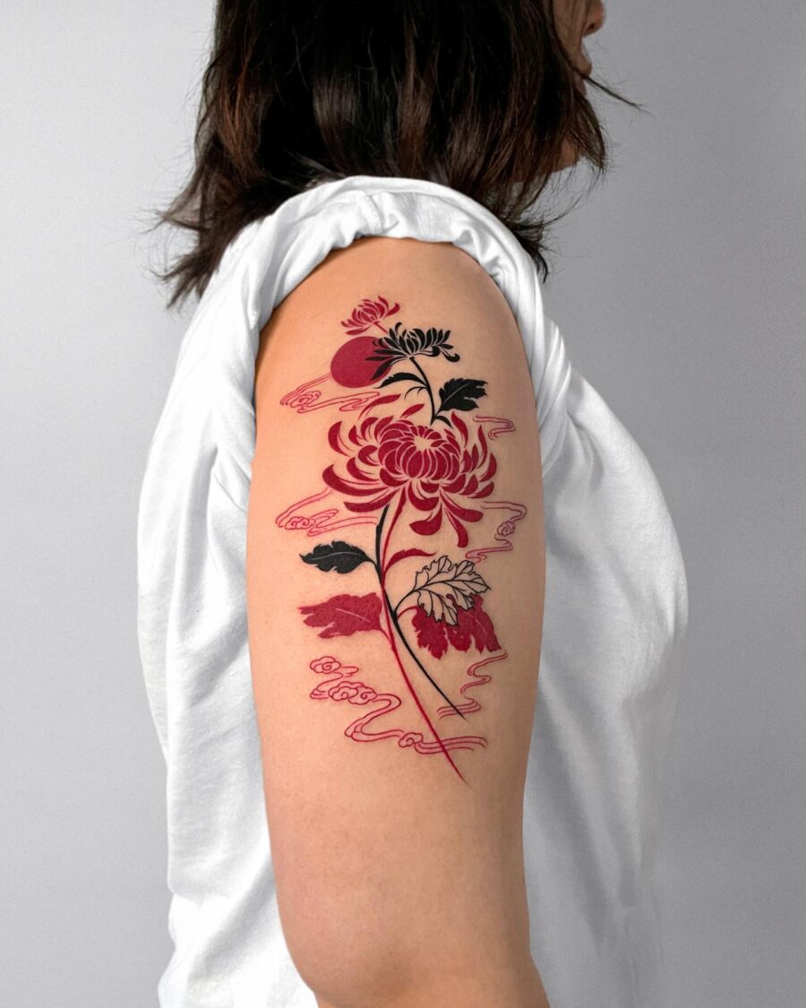 Beautiful red ink floral tattoo on arm