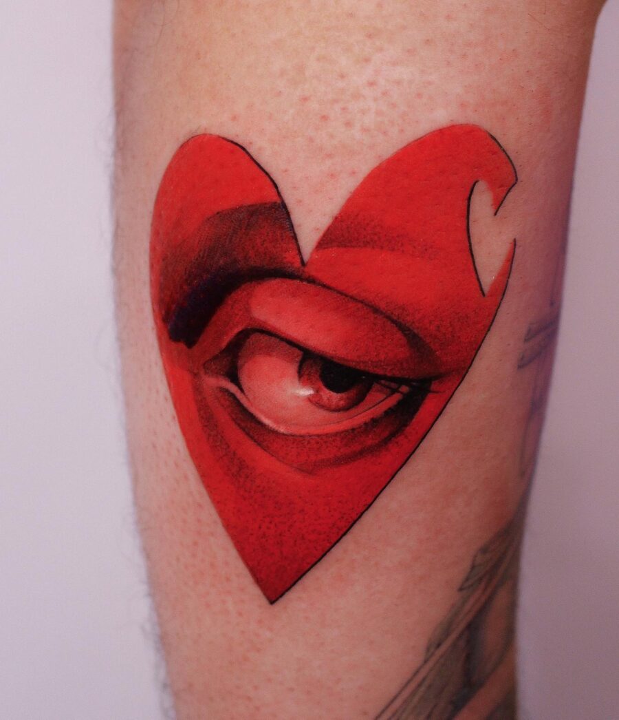 Unique heart-shaped tattoo with an eye design