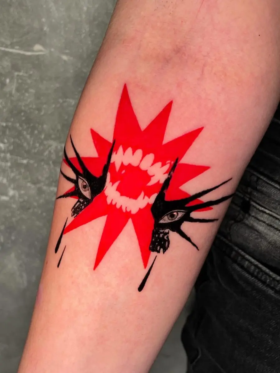 Dynamic red ink tattoo with intense expressions