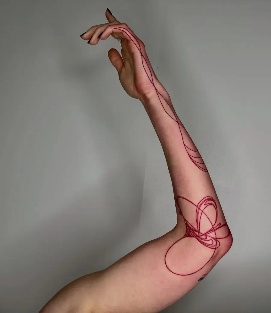Sleek and modern red ink tattoo design