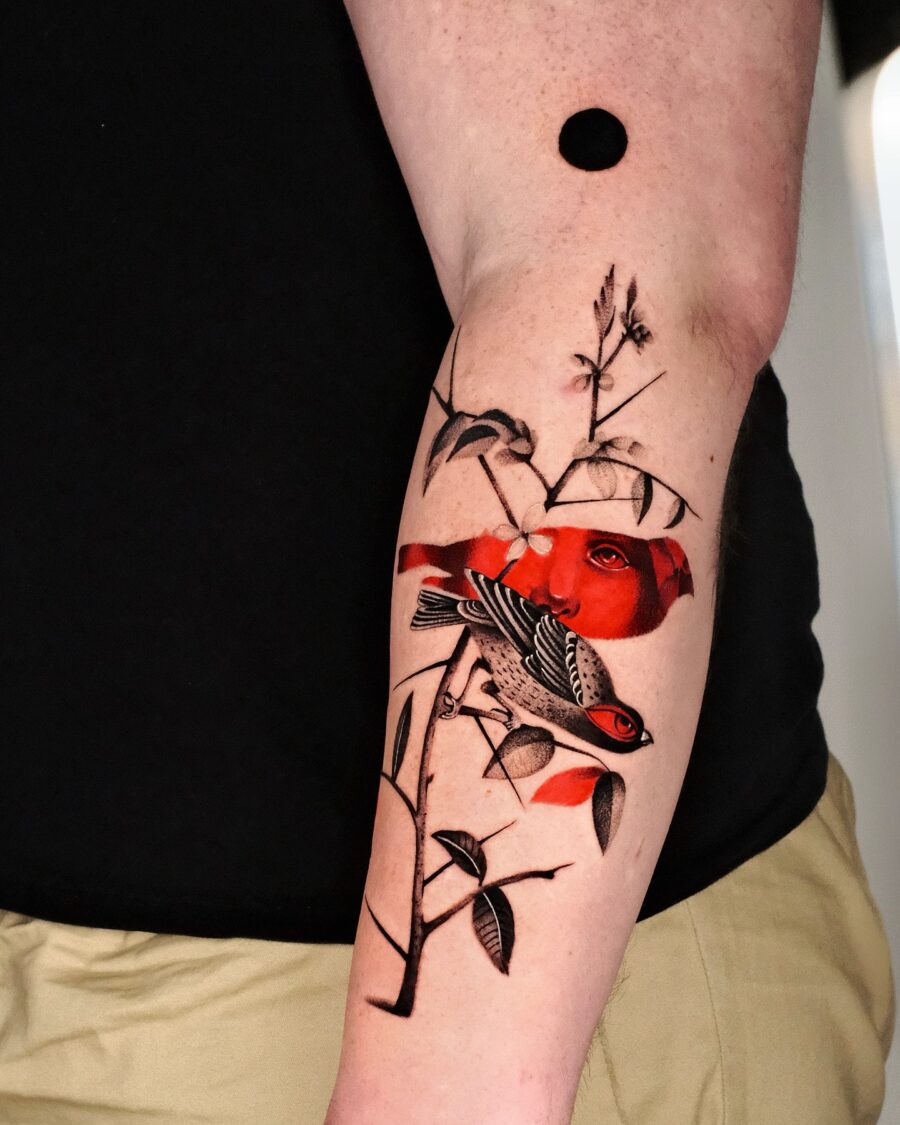 Vibrant Red Ink Bird Tattoo on Forearm