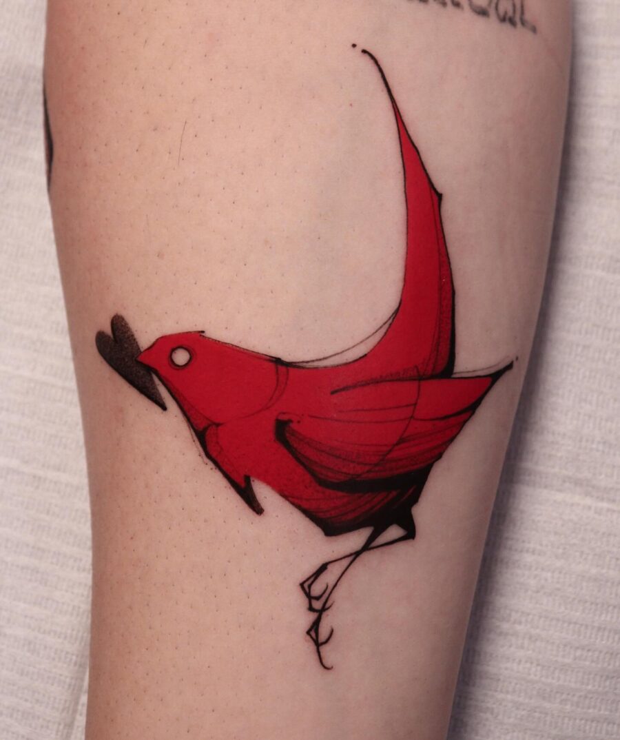 Vibrant red cardinal tattoo in bold style