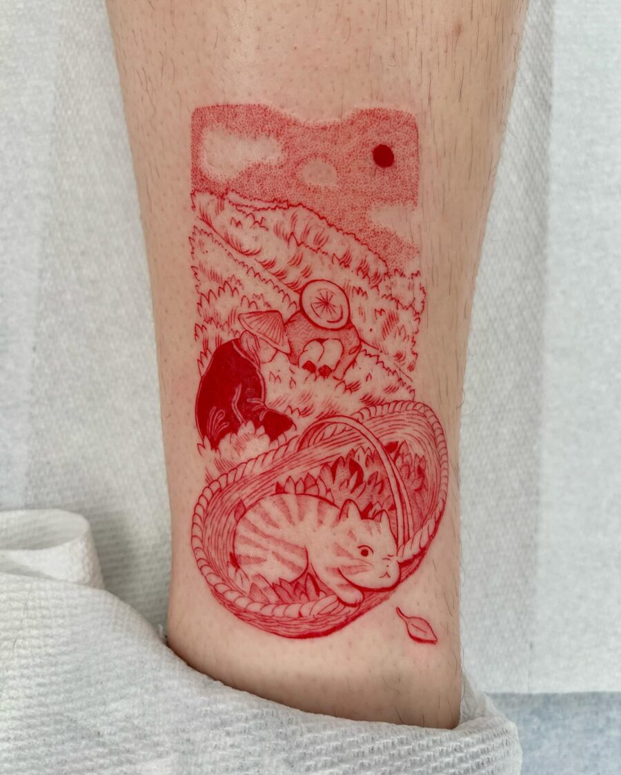 Intricately detailed red ink cat tattoo
