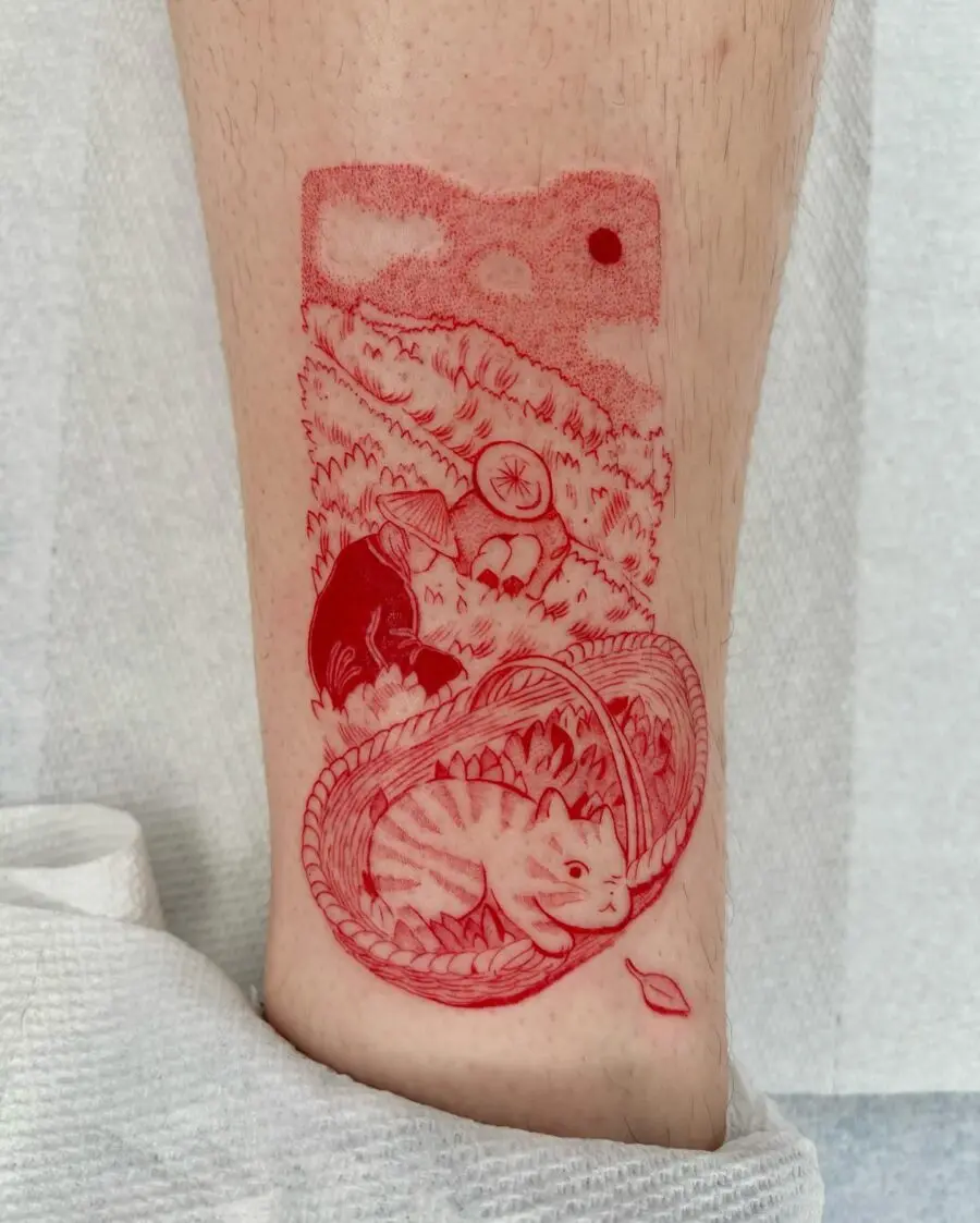 Intricately detailed red ink cat tattoo