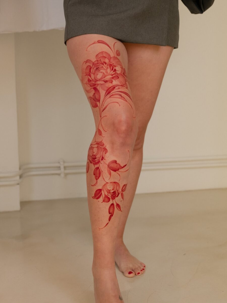 Bold Floral Red Ink Leg Tattoo Design