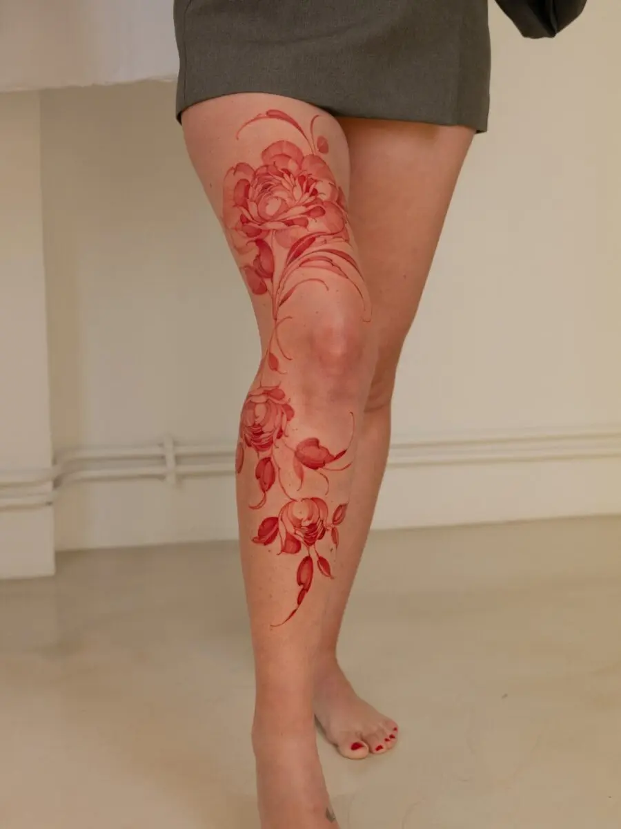 Bold Floral Red Ink Leg Tattoo Design