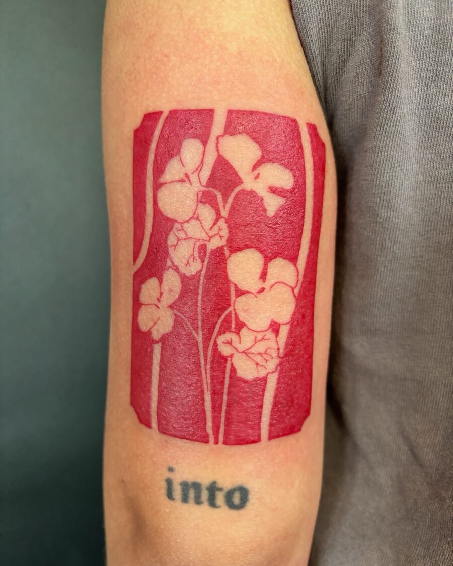 Vibrant Red Ink Floral Tattoo Design