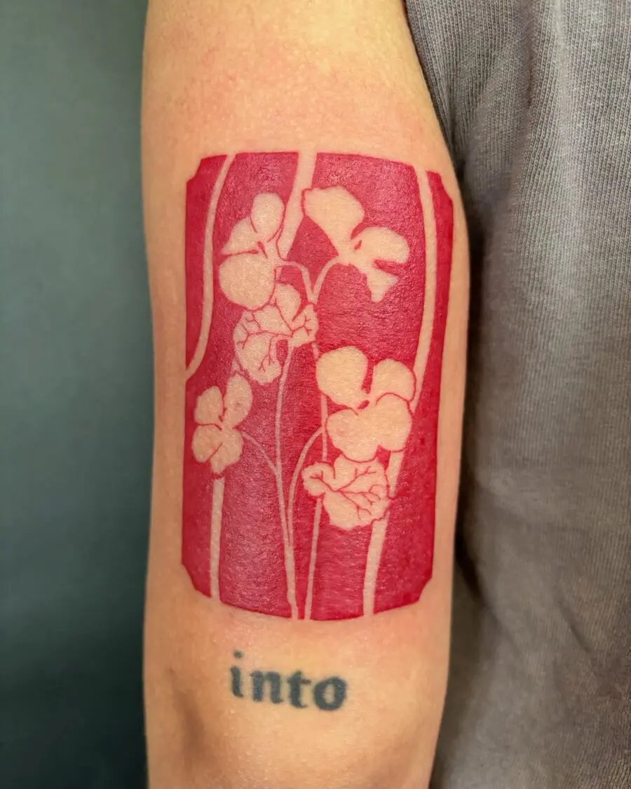 Vibrant Red Ink Floral Tattoo Design