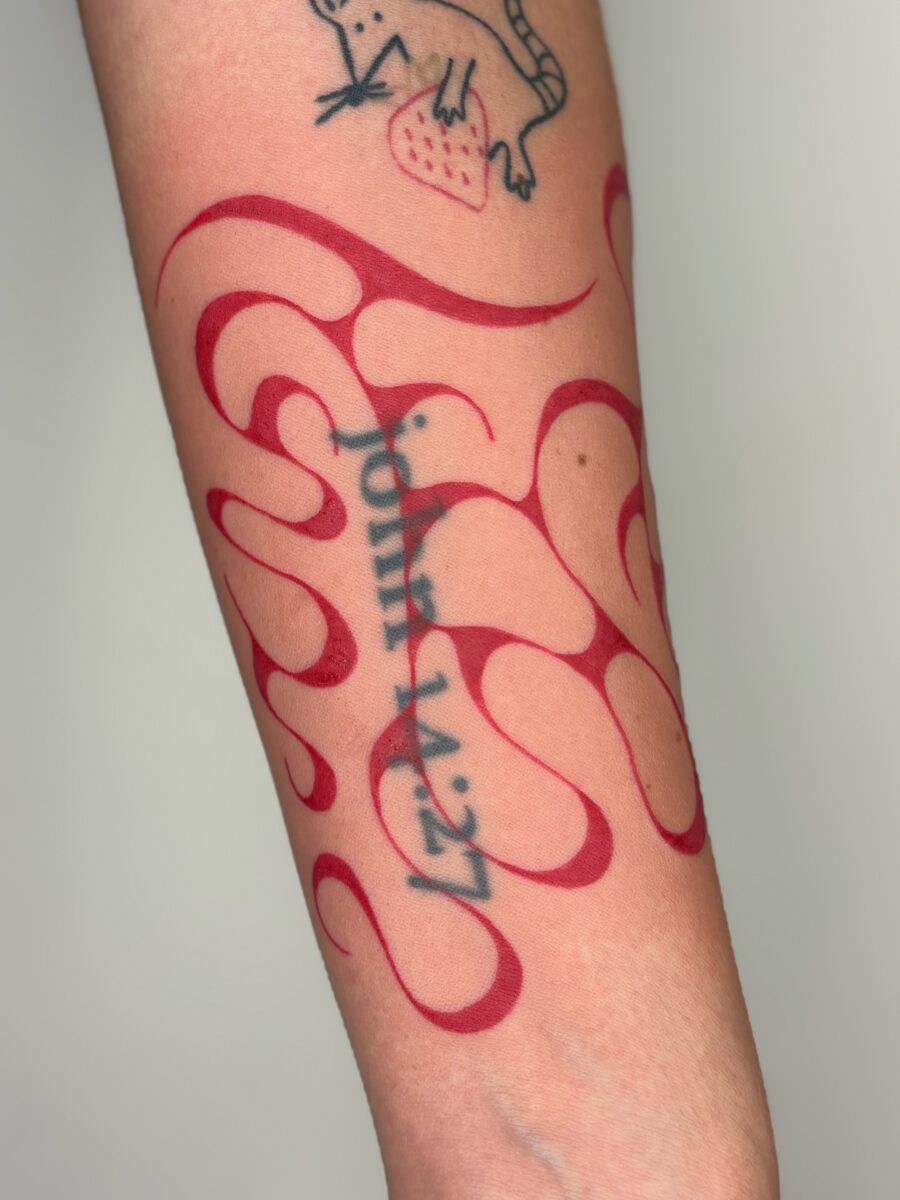 Stylish Red Ink Abstract Tattoo on Forearm