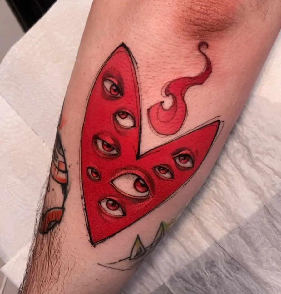 Striking Red Heart Tattoo with Unique Eyes