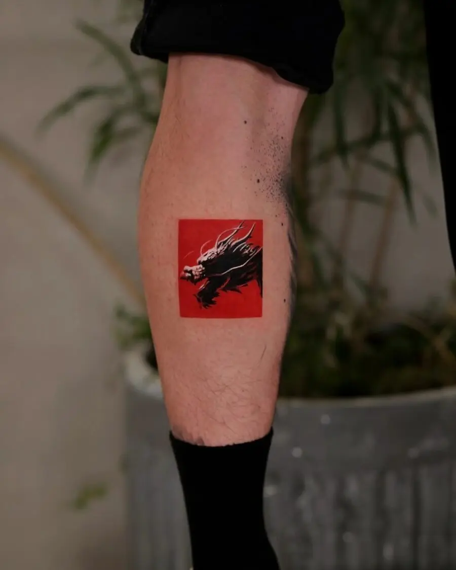 Striking Red Ink Tattoo on Calf
