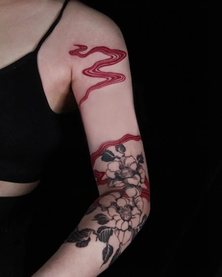 Striking Red Ink Flowing Tattoo Design