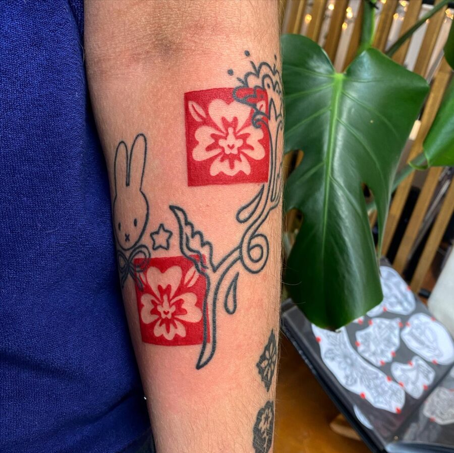 Vibrant red ink floral tattoo art