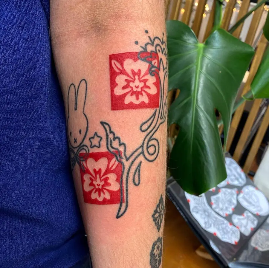 Vibrant red ink floral tattoo art