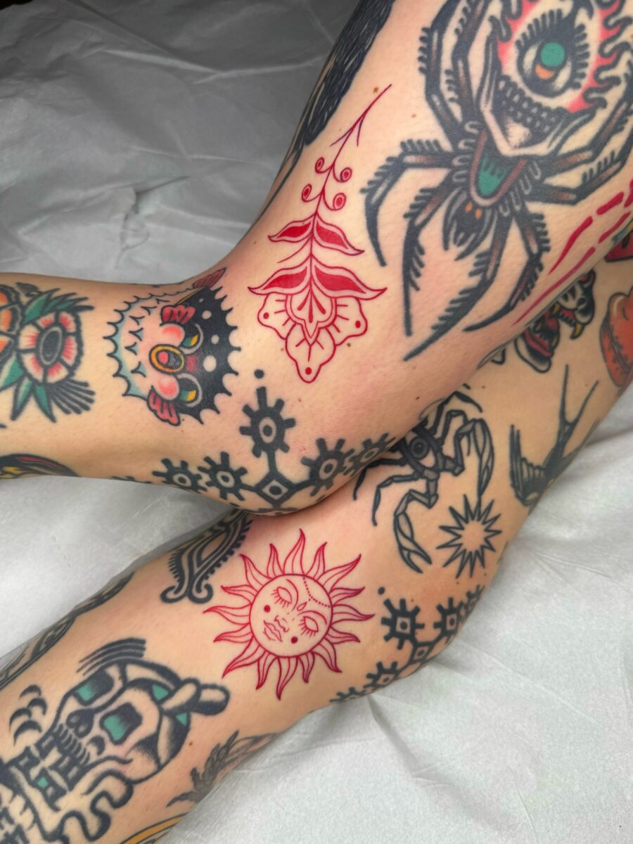 Vibrant red ink tattoos showcasing nature's beauty