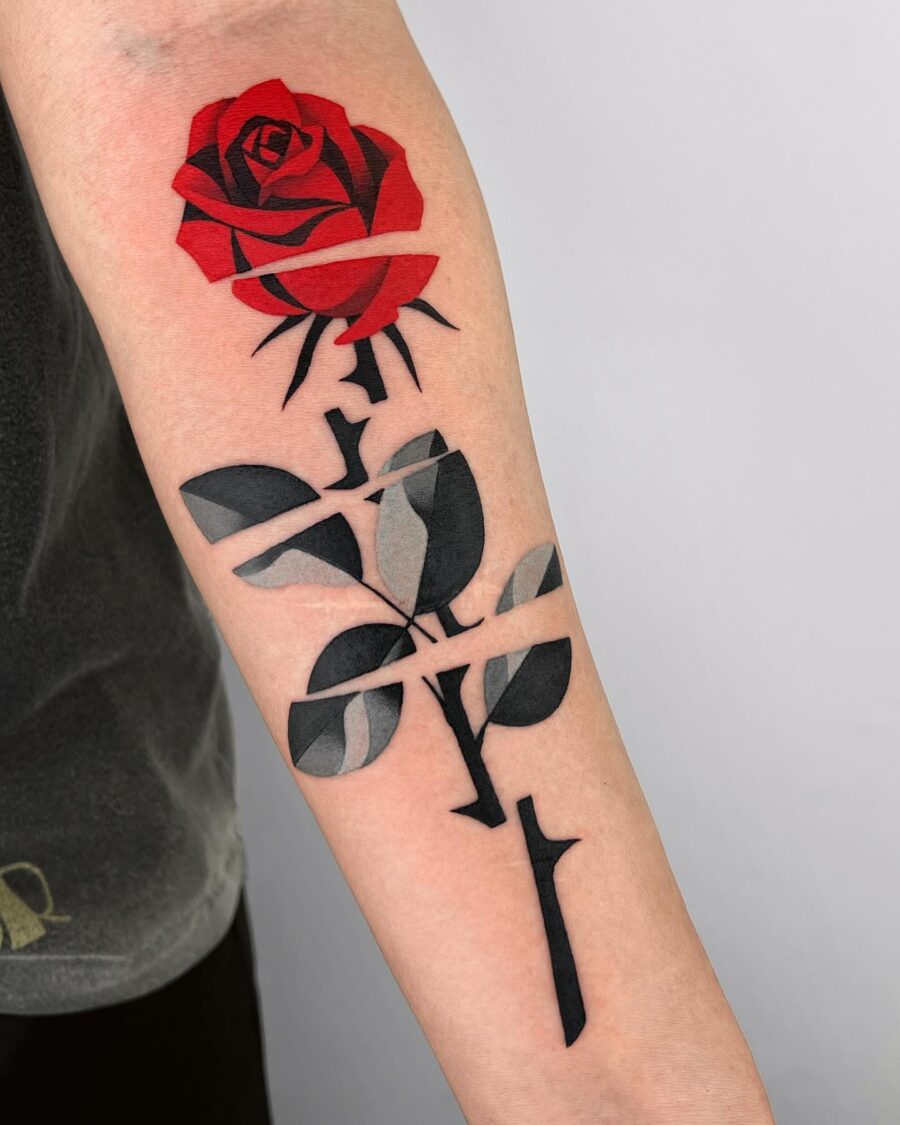 Stunning red rose with black leaves tattoo