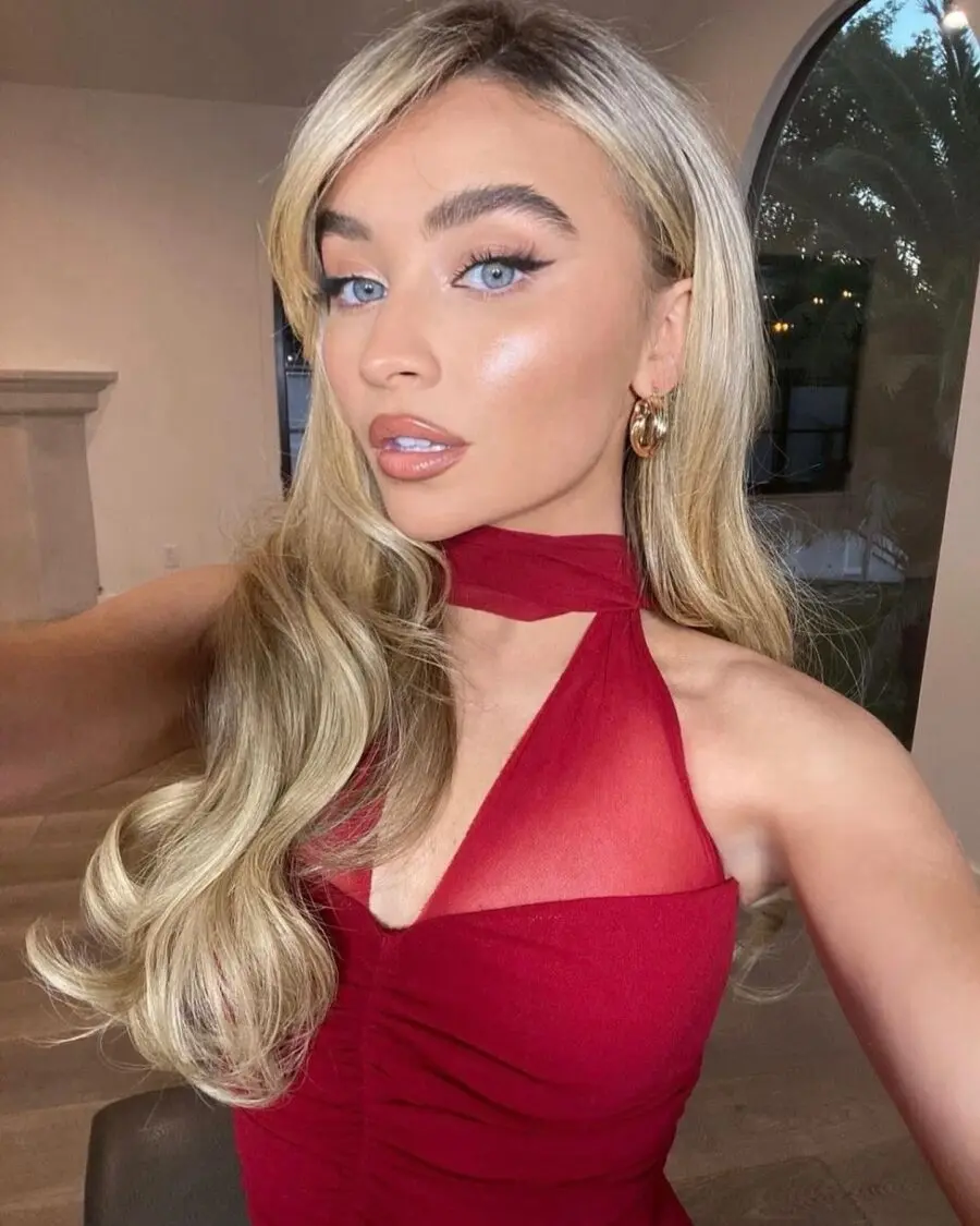 Glamorous makeup look with a red dress