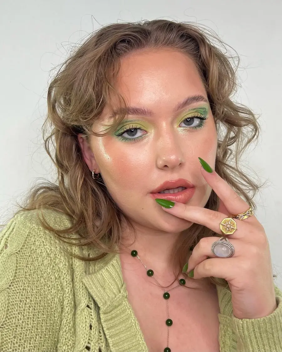 Vibrant green eye makeup with glossy accents