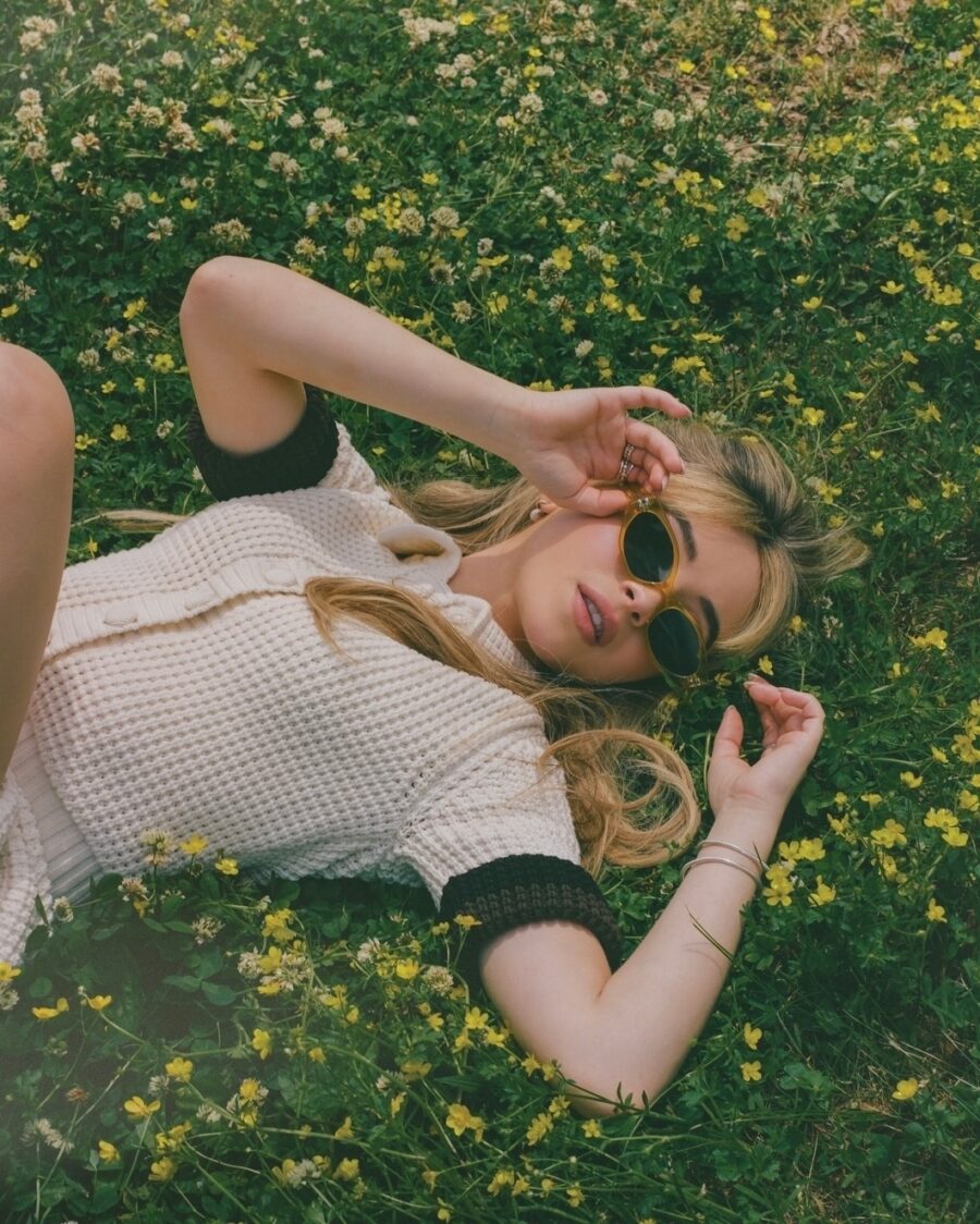 Chic summer outfit in a floral field