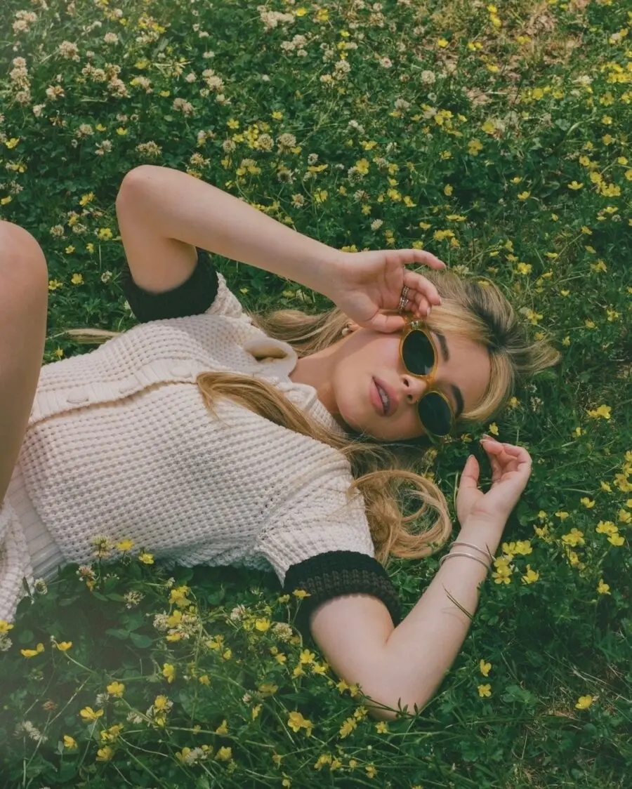 Chic summer outfit in a floral field