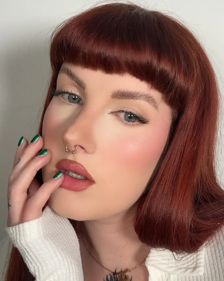 Glamorous makeup look featuring radiant skin.