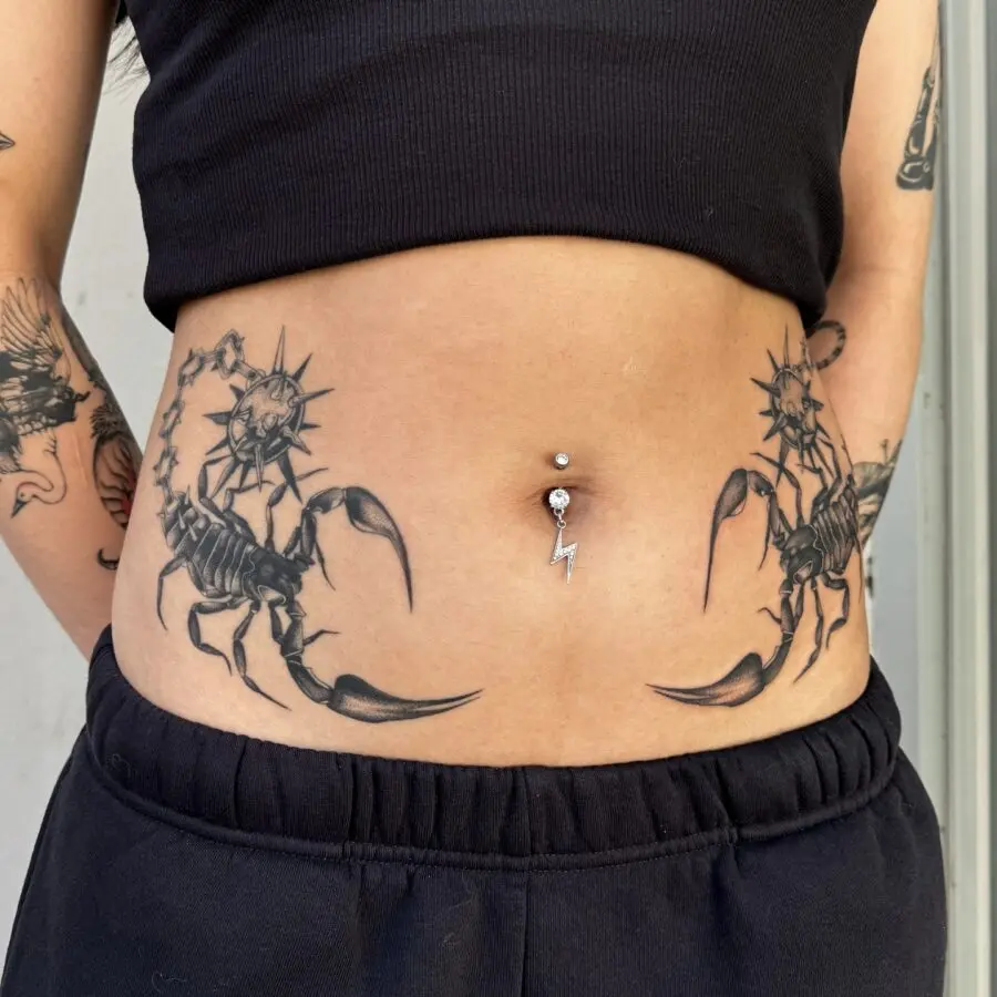 Bold scorpion tattoos on the stomach