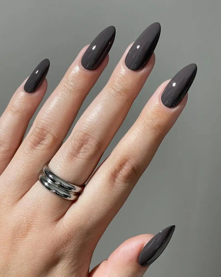 Sleek dark feminine nails create a bold statement