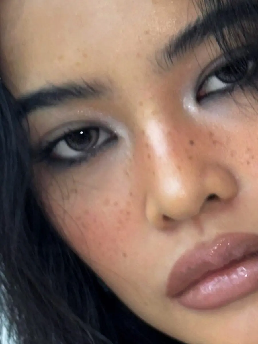Elegant smokey eye with natural freckle accent
