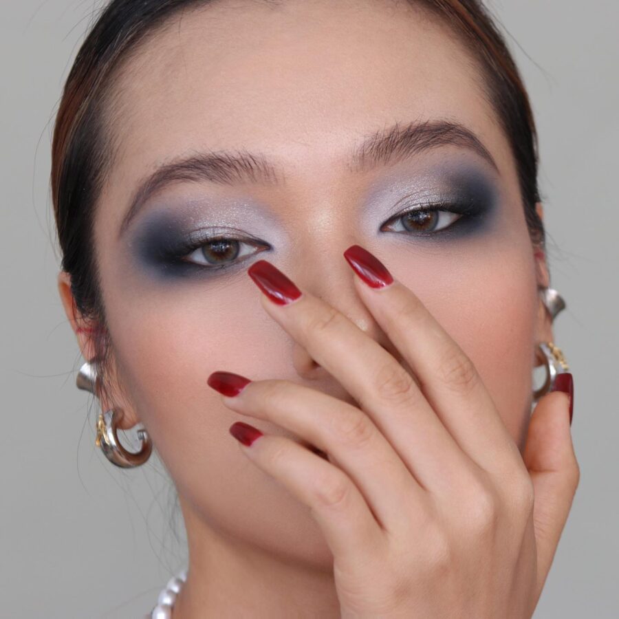 Glamorous smokey eye with striking nails