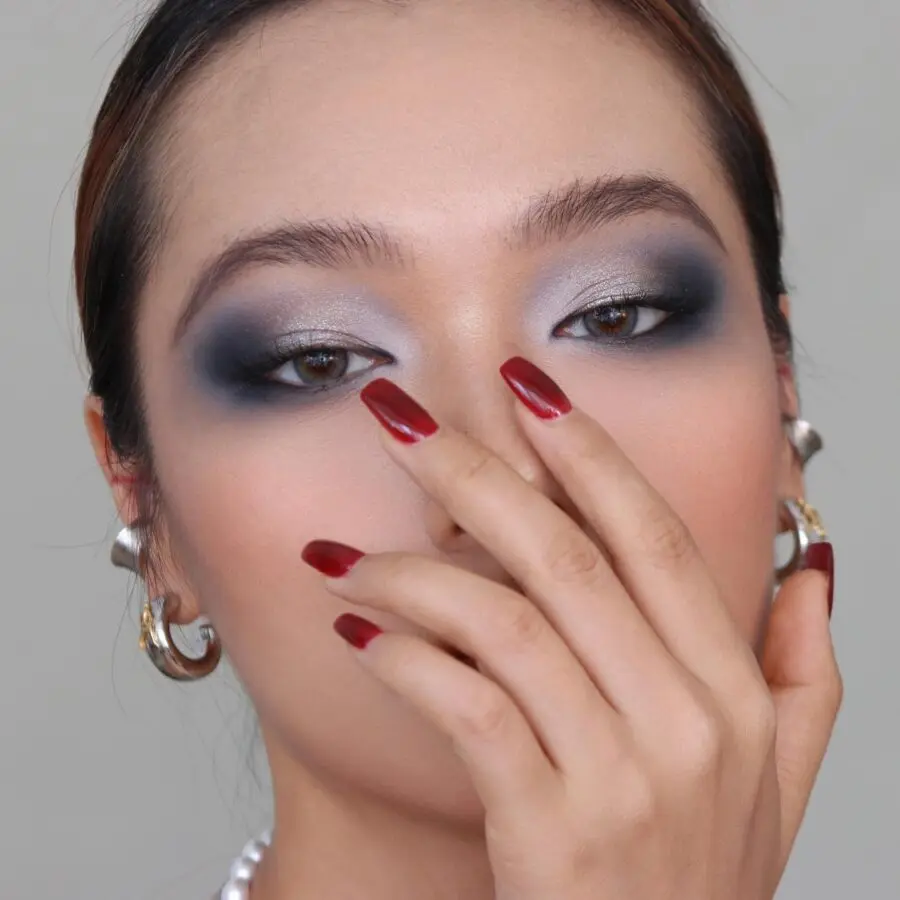 Glamorous smokey eye with striking nails