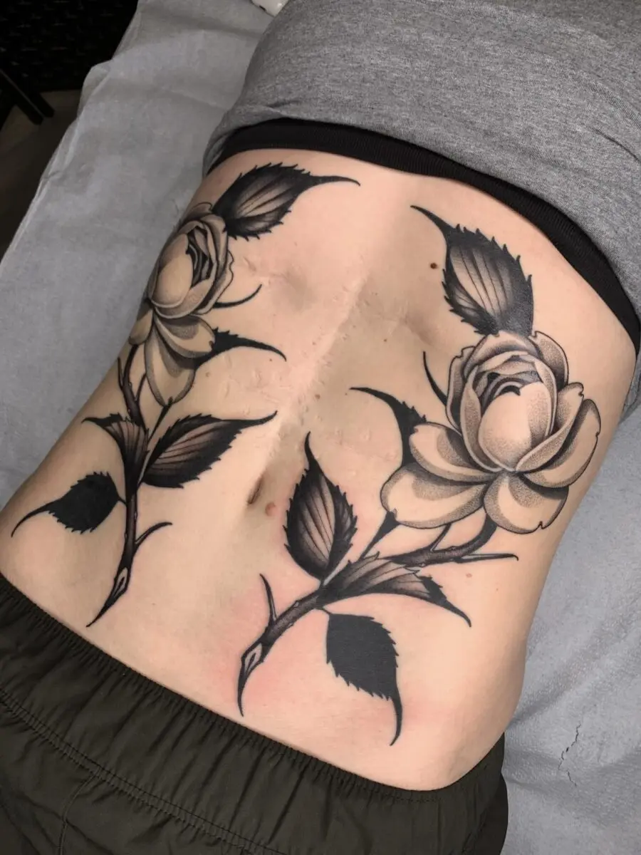 Stunning black and gray rose tattoos on stomach