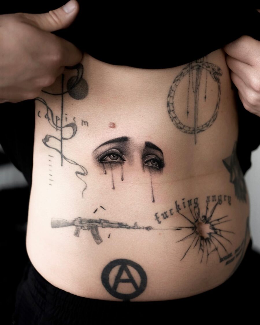 Artistic stomach tattoo reflecting deep emotions