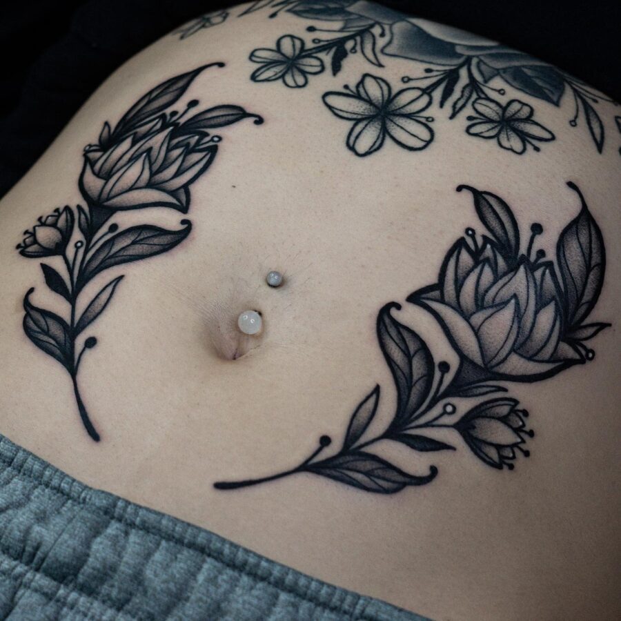 Elegant floral stomach tattoo design with intricate details